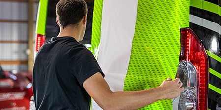 Installer holding IJ280 film panel
